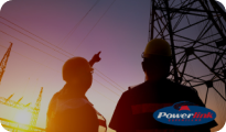 2 workers standing and looking at a mobile tower