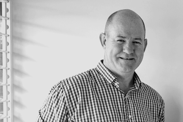 Black and White image of a man smiling