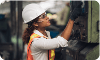 worker checking on an equipment with PPE