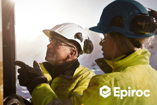 2 site workers discussing wearing PPE